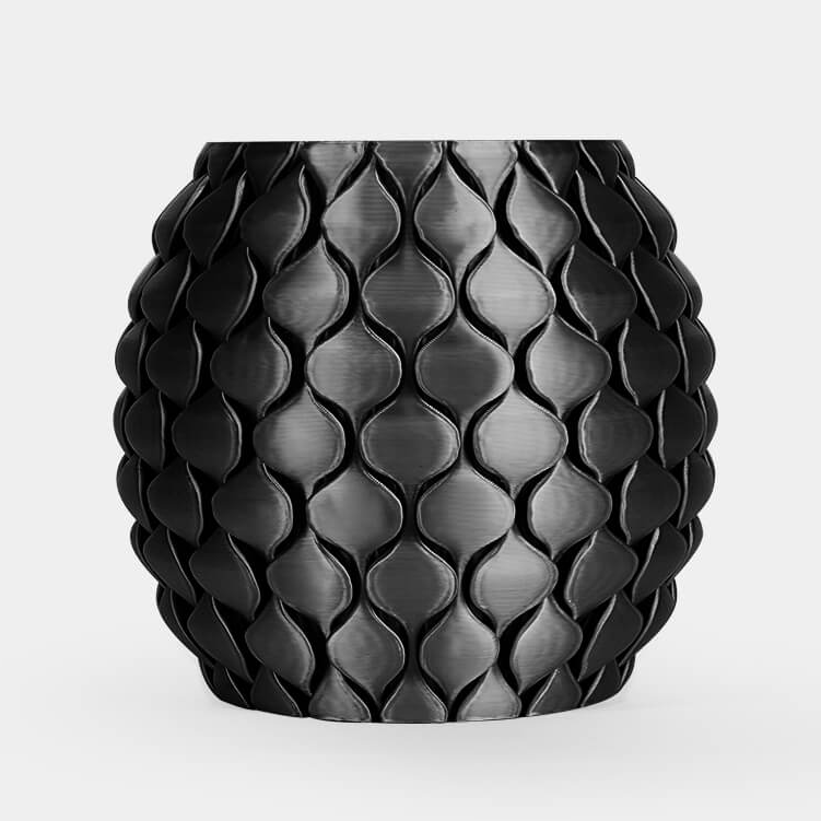 Black textured vase on a white background