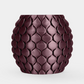 A small round ceramic pot with a textured, overlapping leaf or scale pattern in a deep plum purple color, set against a plain light gray background.