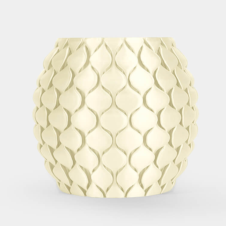 A round, textured ceramic planter or candle holder in a pale cream color, featuring a raised scale-like pattern, set against a solid light gray background.