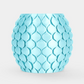 A light blue ceramic planter with a textured, overlapping leaf or scale pattern, centered on a clean white background.