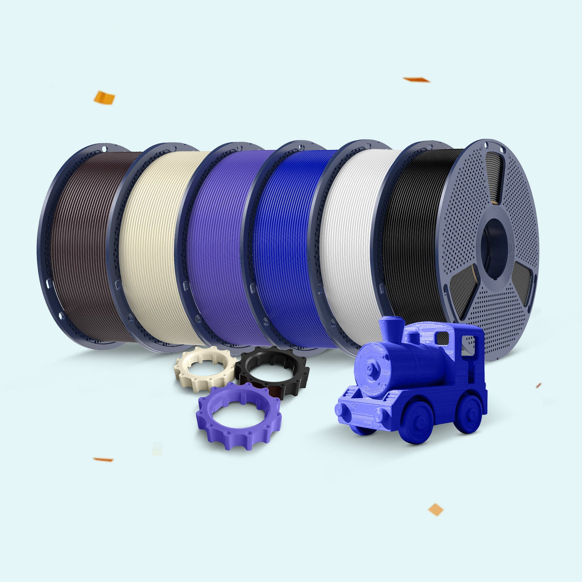 Spools of filament in various colors with a toy train model on a light blue background, celebrating a 12th anniversary.